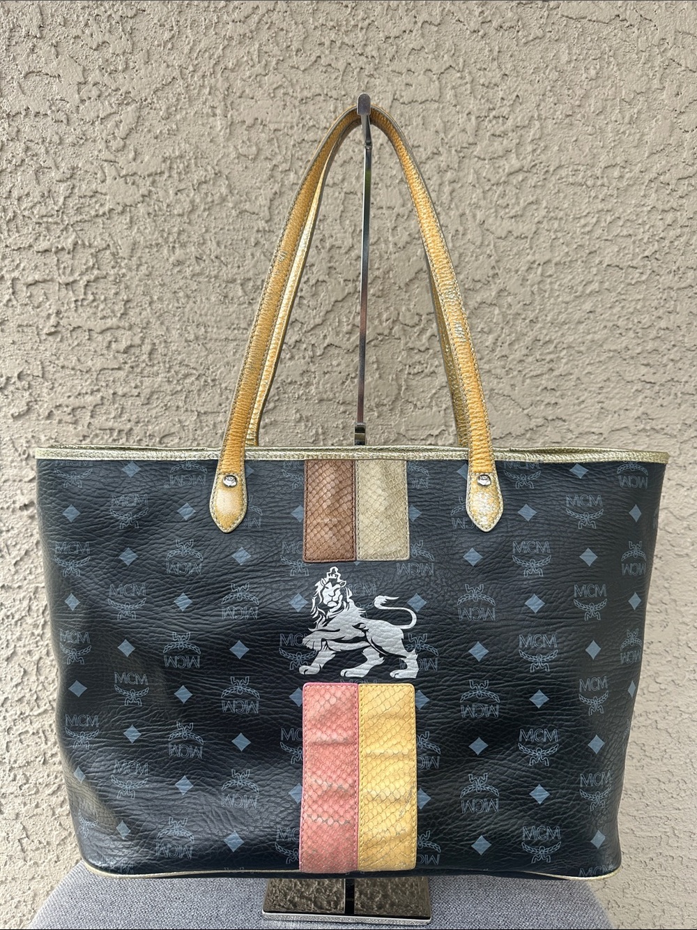 MCM monogram with metallic gold accents tote bag